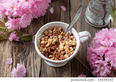 Breakfast cereals in a cup with kwanzan cherries 54644593