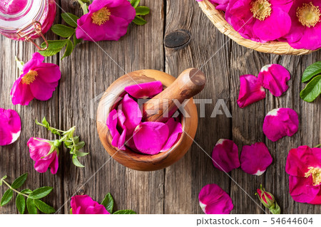 Fresh rosa rugosa flowers in a wooden mortar 54644604