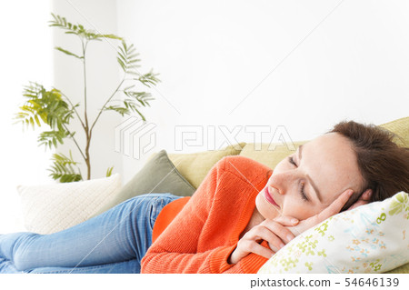 Woman taking a nap at home 54646139