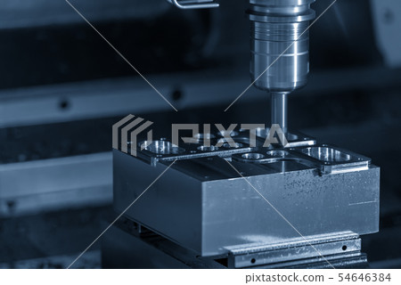 The CNC milling machine cutting mould parts . The CNC milling machine cutting mould parts . 54646384
