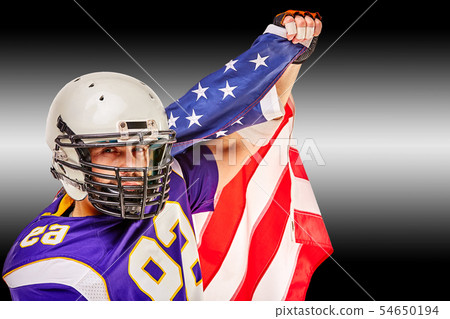 American football player closeup portrait. American football player with an american flag in his American football player closeup portrait. American football player with an american flag in his 54650194