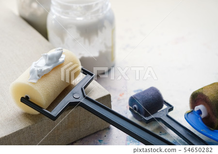 Artist brush rollers and linen canvas. Artist brush rollers and linen canvas. 54650282