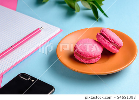 Coffee break in a colorful girly workspace Coffee break in a colorful girly workspace 54651398