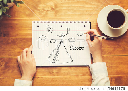Standing on the top of a mountain with a person holding a pen Standing on the top of a mountain with a person holding a pen 54654176
