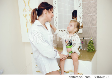 Mother with cute daughter in a bathroom 54660522