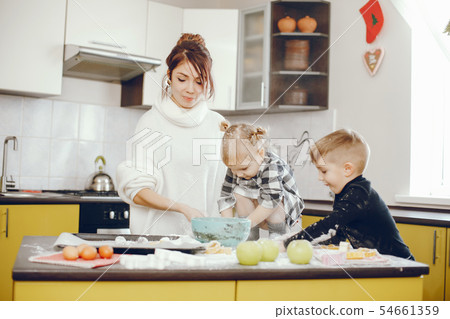 Cute family prepare the breakfest in a kitchen 54661359
