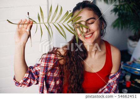 Fashion girl standing in a studio Fashion girl standing in a studio 54662451