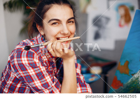 Elegant girl draws in an art studio 54662505