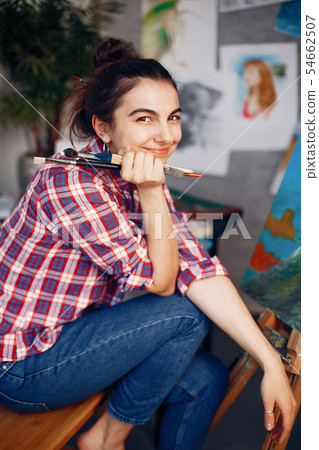 Elegant girl draws in an art studio 54662507