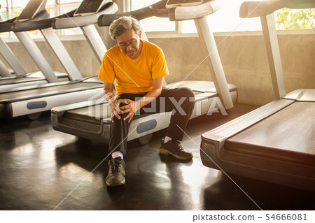 Senior asian sport man injury knee pain sitting Senior asian sport man injury knee pain sitting 54666081