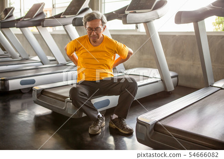 Senior asian sport man injury back pain  sitting 54666082