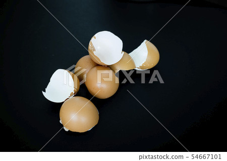 Chicken egg shell on black background, focus 54667101