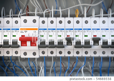 Automatic circuit brakers in a row.  54669338