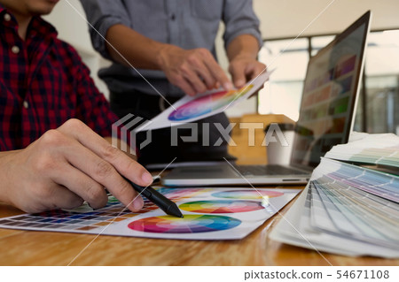 Graphic designers choose colors bands samples. 54671108