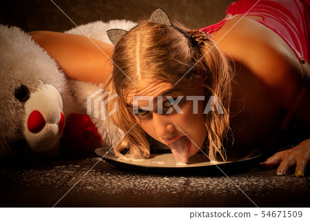 girl laps milk girl laps milk 54671509
