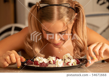 girl eats strawberry girl eats strawberry 54671668