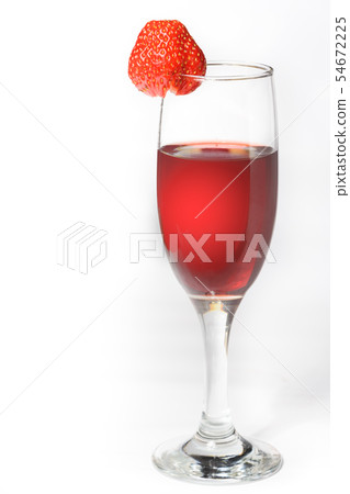 A glass of red wine with strawberries on a white 54672225