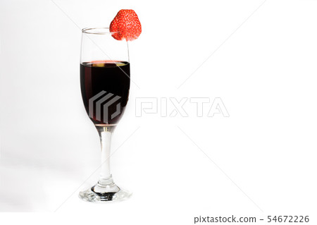 A glass of red wine with strawberries on a white A glass of red wine with strawberries on a white 54672226