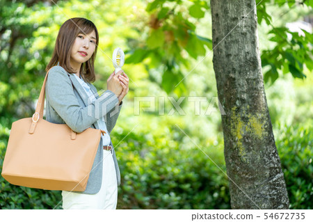 Businesswoman outdoor mini fan Businesswoman outdoor mini fan 54672735