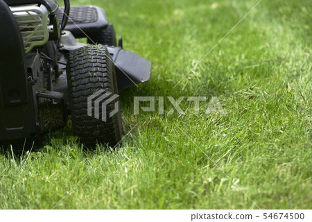 lawn mowers on the field lawn mowers on the field 54674500