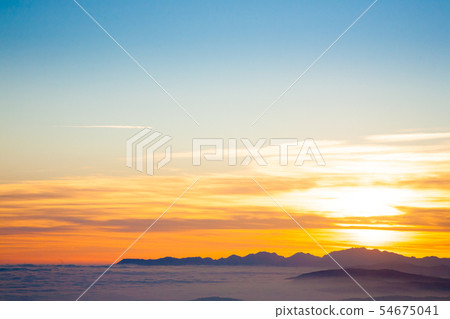 Mountain silhouette at sundown Mountain silhouette at sundown 54675041