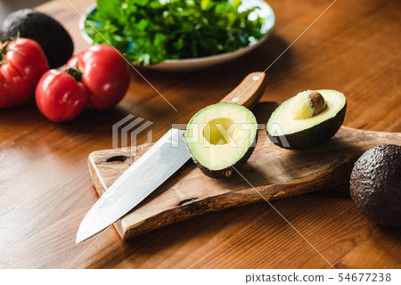 Avocado and ingredients for healthy cooking Avocado and ingredients for healthy cooking 54677238