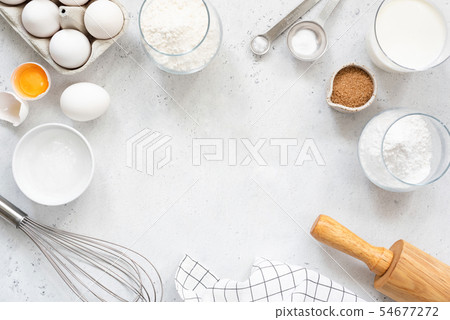 Baking and cooking ingredients on bright grey background Baking and cooking ingredients on bright grey background 54677272
