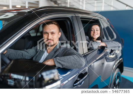 Couple buying new car, departure from the salon 54677365