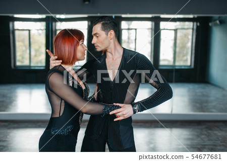 Man and woman on ballrom dance training in class 54677681