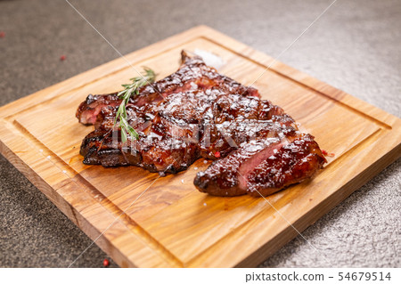 Food, delicious, horse meat and craft concept - serving of grilled steak 54679514