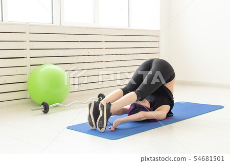 Healthy lifestyle, people and sport concept - Woman workout with stretching Healthy lifestyle, people and sport concept - Woman workout with stretching 54681501