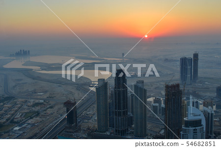 Aerial view of Dubai City at sunrise Aerial view of Dubai City at sunrise 54682851