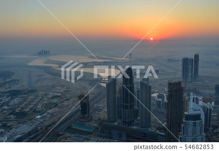 Aerial view of Dubai City at sunrise Aerial view of Dubai City at sunrise 54682853