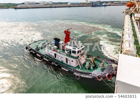 Tugboat pushing a car ferry 54683831