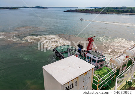 Tugboat pushing a car ferry 54683992