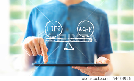 Life and work balance with man using a tablet 54684996