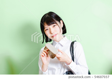 Businesswoman green background Businesswoman green background 54687037