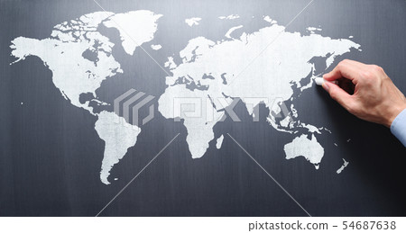 Map of the world drawn on a blackboard. Teacher's hand pointing to Japan. 54687638