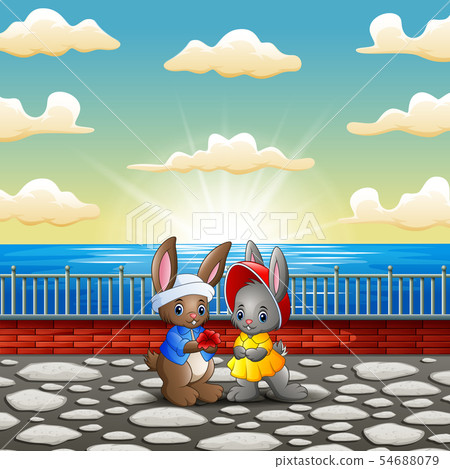 Couple rabbit cartoon in the riverbank with sunset 54688079