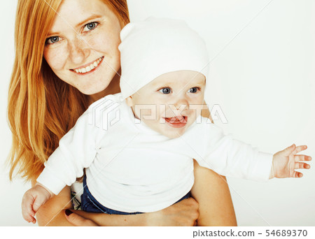 young beauty mother with cute baby, red head happy modern family smiling isolated on white 54689370