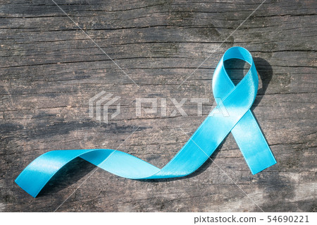 Blue ribbon symbolic of prostate cancer awareness Blue ribbon symbolic of prostate cancer awareness 54690221