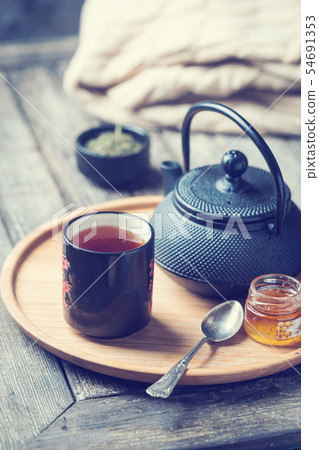 tea cup with tea pot on a tray tea cup with tea pot on a tray 54691353