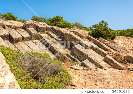 Rocky coast of Punta de n'Amer on Island Mallorca 54691623