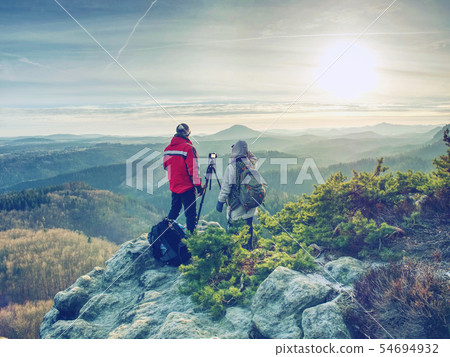 Photographer and woman photographing with camera 54694932
