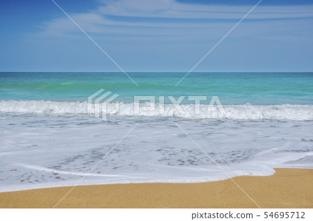 Beach sand and blue sea in blue sky 54695712