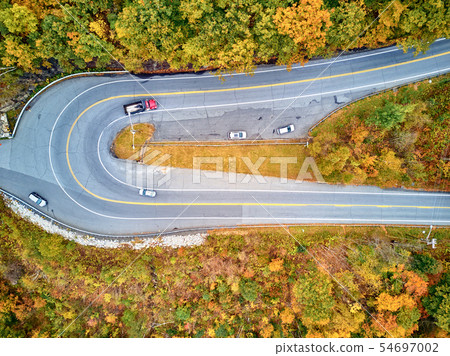 Scenic highway hairpin turn in autumn Scenic highway hairpin turn in autumn 54697002