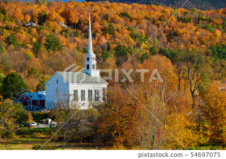 Iconic New England church in Stowe town at autumn 54697075