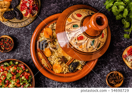 Traditional moroccan tajine of chicken with dried Traditional moroccan tajine of chicken with dried 54698729