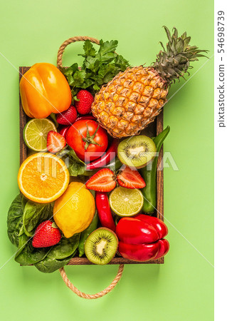 Fruits and vegetables rich in vitamin C in box. Fruits and vegetables rich in vitamin C in box. 54698739