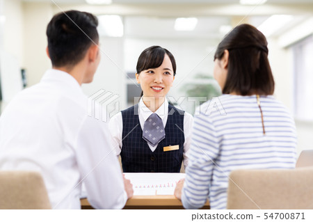 Young couple (consulting) Young couple (consulting) 54700871